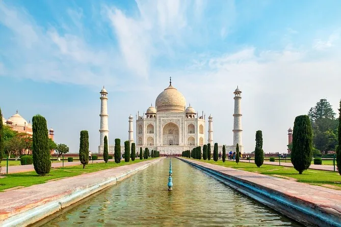 The Taj Mahal at the end of its long reflecting pool lined with cypress trees